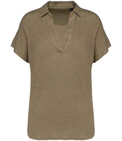 Stylish women's linen polo shirt styled with dropped sleeves, perfect for a sophisticated and relaxed look.