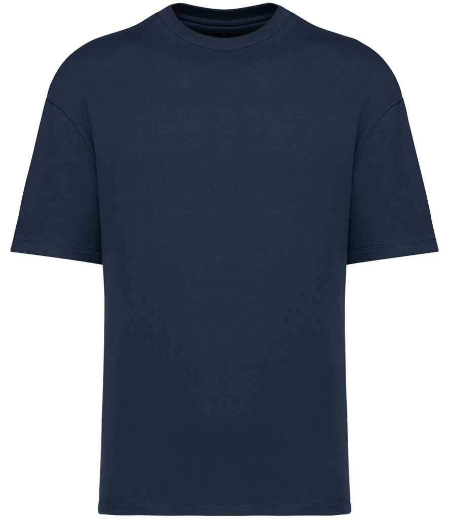 Detailed view of the hybrid sweatshirt-tee construction of the oversized French terry t-shirt, illustrating the structural yet comfortable design perfect for casual elegance.