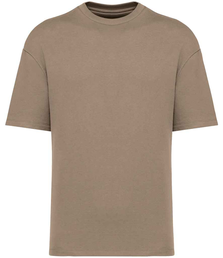 Elegantly styled organic oversized French terry t-shirt showcasing eco-friendly 85% cotton fabric in a soft enzyme-washed finish, perfect for a luxurious casual look.