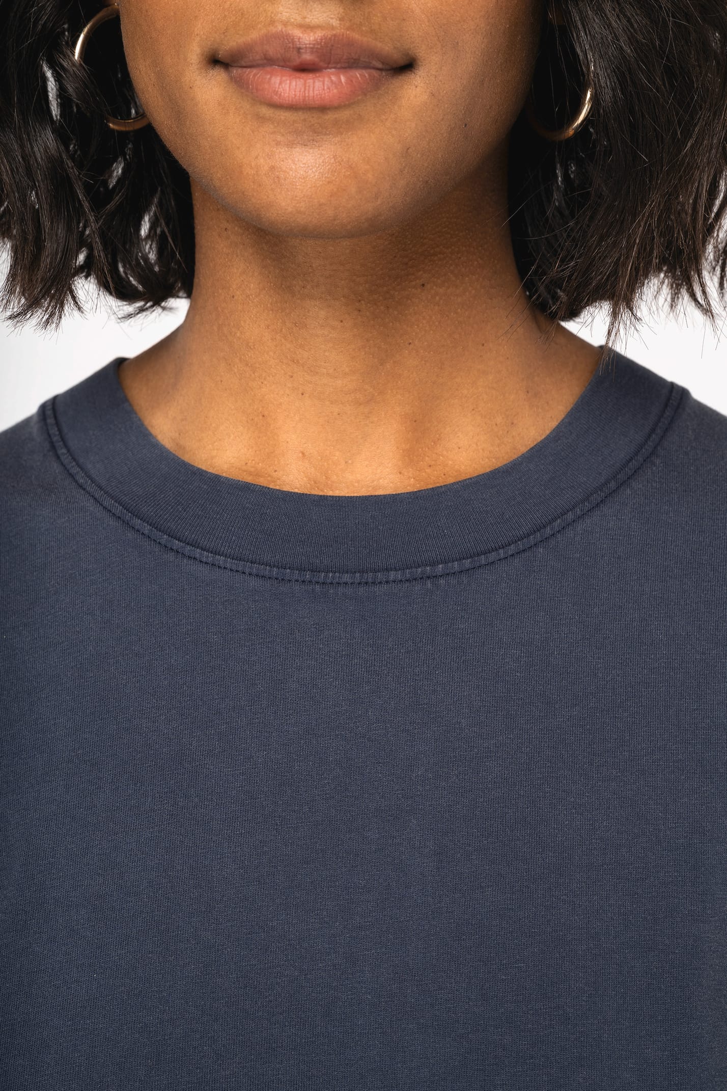 Flat lay arrangement of the Luxury Organic Oversized Washed T-shirt, emphasising its ethical craftsmanship and timeless style, perfect for any wardrobe.