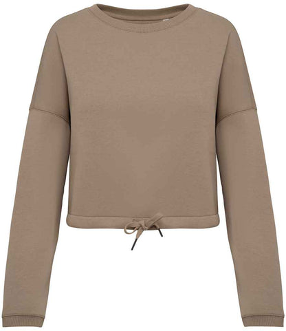 Detail view of the cropped hemline of the women's sweatshirt, designed for modern layering and chic casual looks.