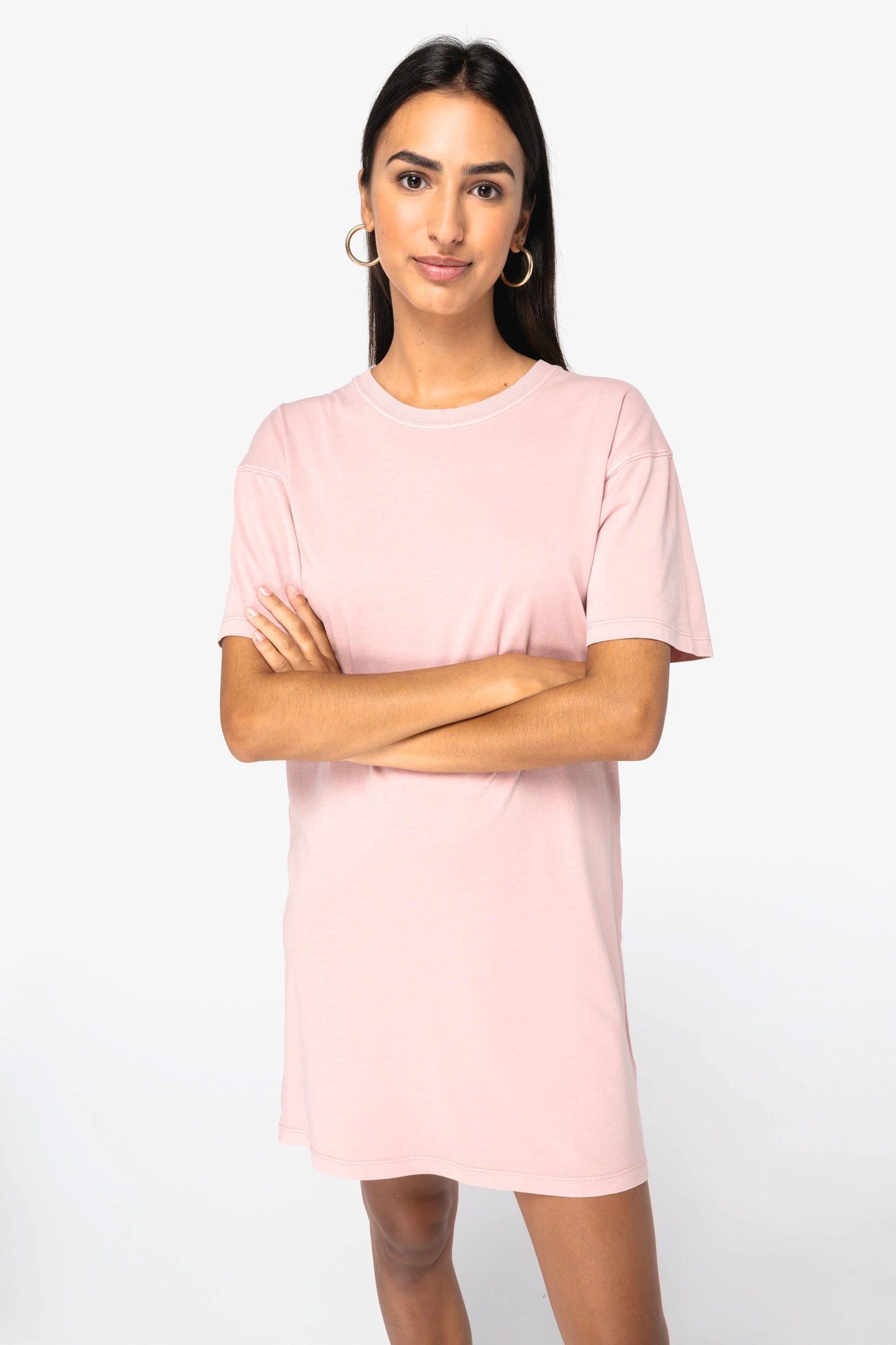 Folded luxurious organic cotton stonewash t-shirt dress, displaying rich colour tones and fine craftsmanship for stylish comfort.