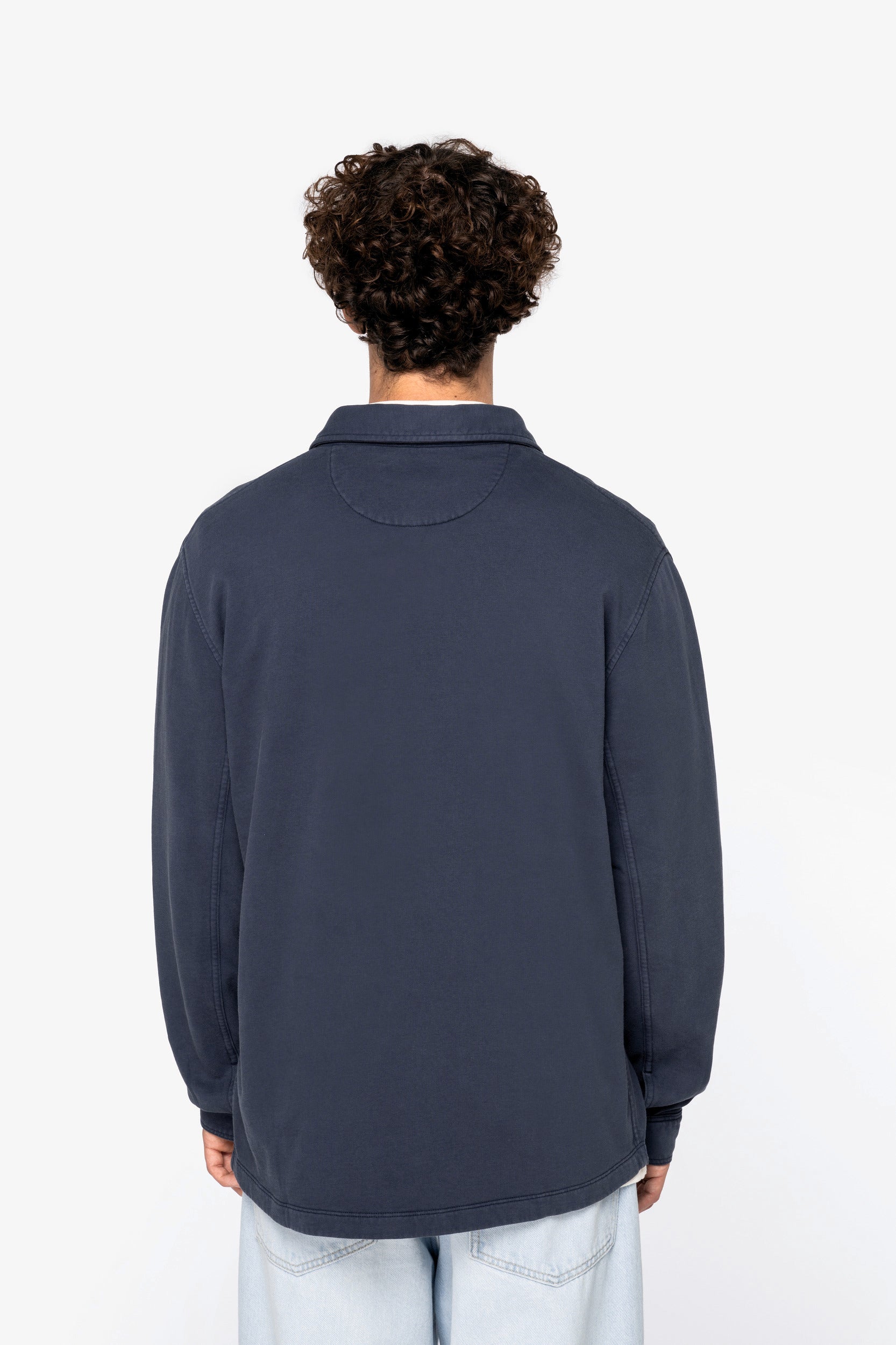 Elegant display of the versatile fit of the vintage-inspired organic cotton faded overshirt for men.