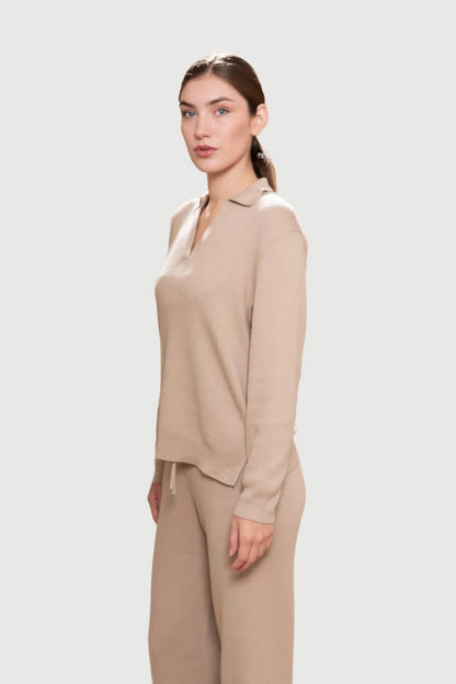 Relaxed fit luxury loungewear trousers in a stylish setting, showcasing the comfortable drawstring waistband and high-quality fabric.