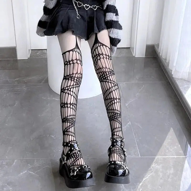 Exquisite Dazzling Dreams Studio Pentacle Design Fishnet Stockings in an intricate geometric pattern, elegantly worn with a stylish outfit, showcasing a modern fashion flair.