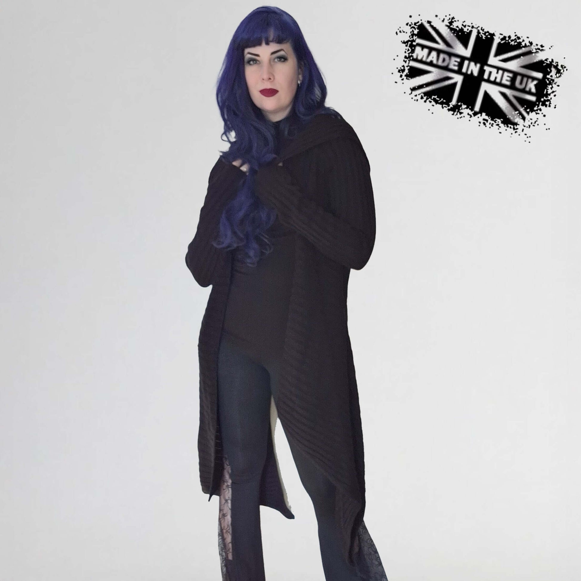 Model wearing the Necessary Evil Sabrina Ribbed Hooded Cardigan, styled with a corset, illustrating its versatile layering capabilities for alternative fashion.