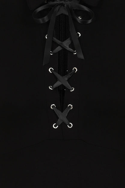 Model wearing the Necessary Evil Kali Gothic Midi Dress, exuding sophisticated gothic style with asymmetric hem and elegant silhouette.