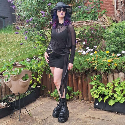 Model wearing the Necessary Evil Anahita Sheer Black Mesh Layer Dress, demonstrating its dramatic silhouette and flattering fit, styled with gothic accessories.