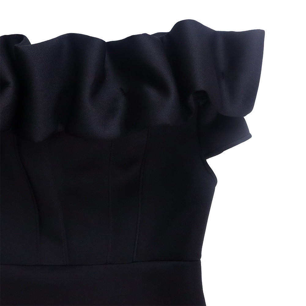 Captivating side view of the sophisticated mermaid evening gown, emphasizing the graceful flow of the fabric and its exquisite craftsmanship.