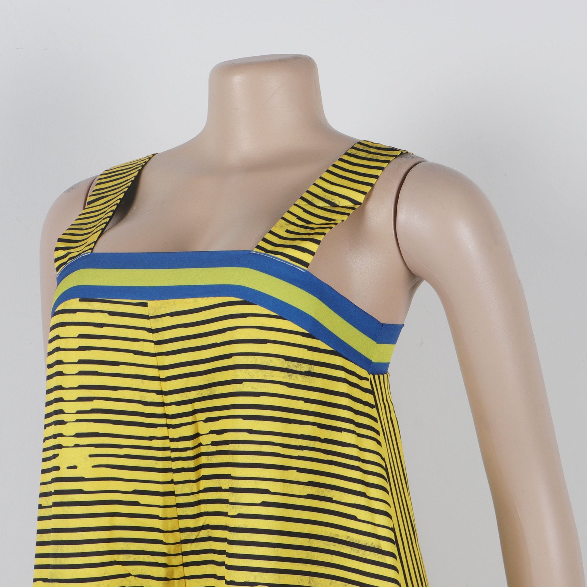 Model wearing CM.YAYA Women’s Striped Wide Leg Sleeveless Jumpsuit, demonstrating its versatility for day and night occasions with a luxurious flair by Hot Trends Area.