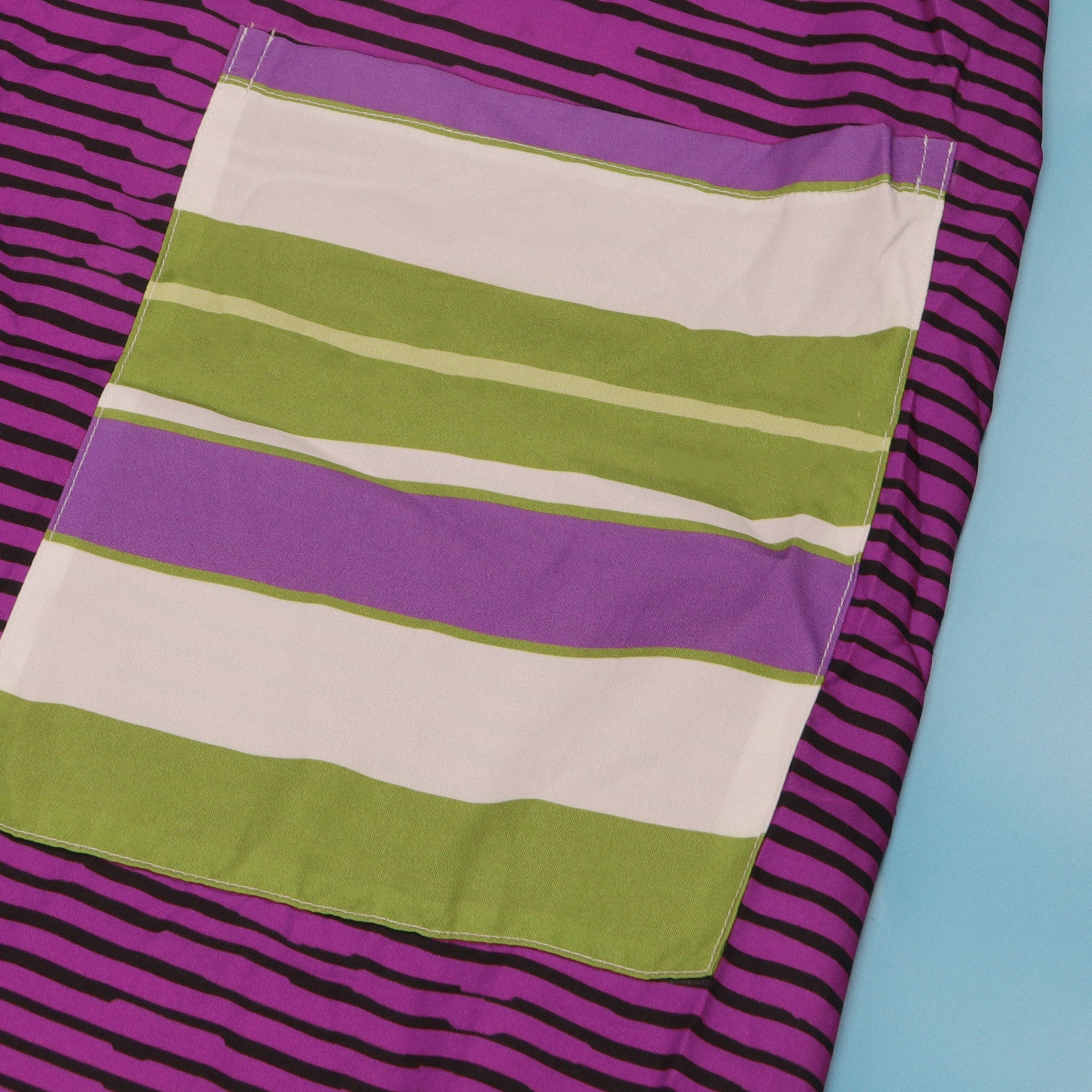 Back view of the CM.YAYA Women’s Striped Wide Leg Jumpsuit highlighting its flattering loose fit and sleeveless design, perfect for warm summer events.