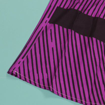 Lifestyle image of a model wearing the CM.YAYA Women’s Striped Wide Leg Jumpsuit, enhancing the relaxed elegance of summer fashion.