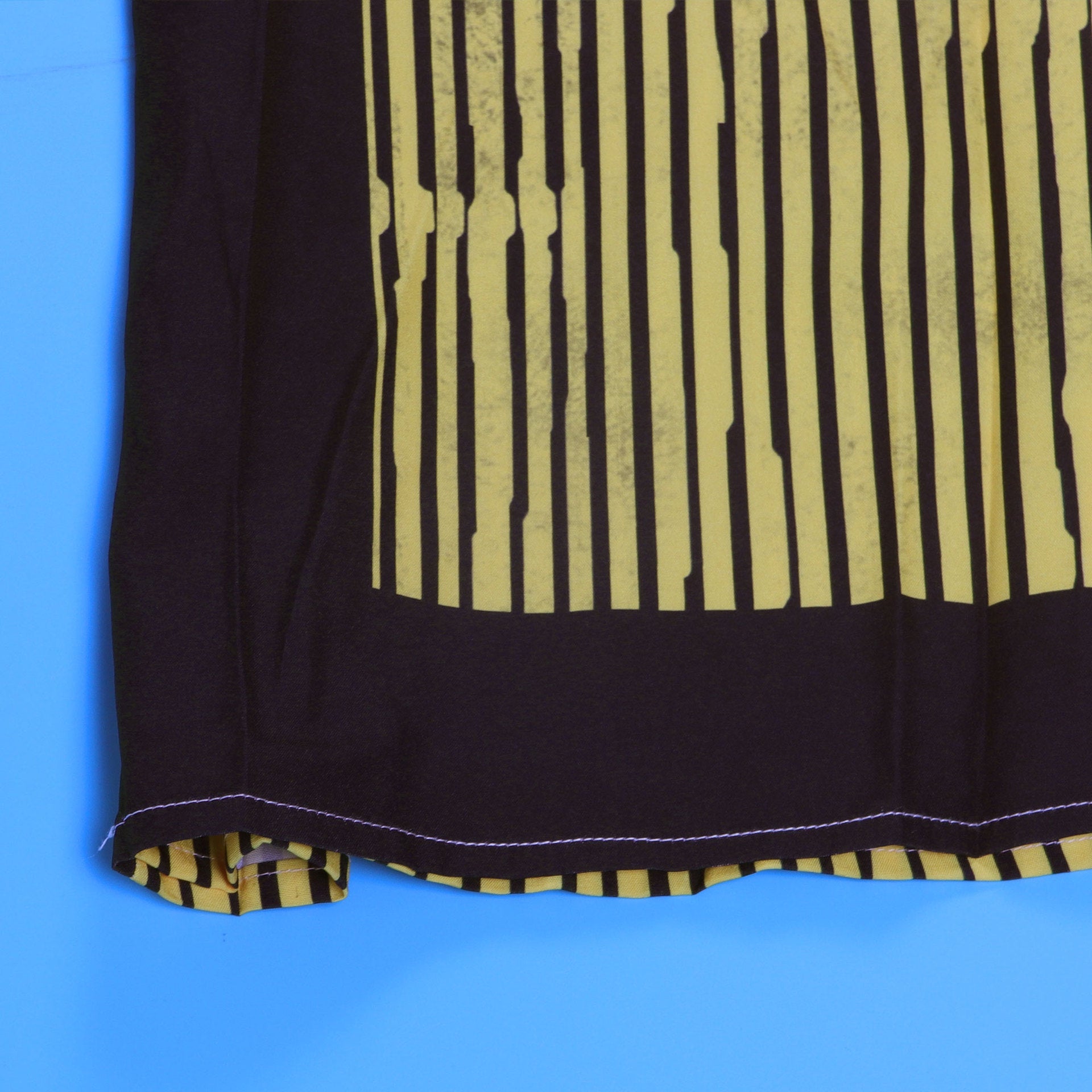 Elegant CM.YAYA Women’s Striped Wide Leg Sleeveless Jumpsuit with Pockets and High Waist, showcasing its sophisticated design and chic striped pattern in a luxurious summer setting.