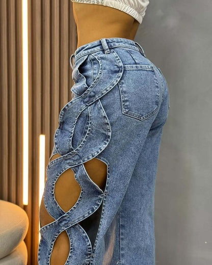 Close-up view of BKQU elegant blue denim jeans, featuring delicate hollow out embellishments that elevate casual attire to chic elegance.