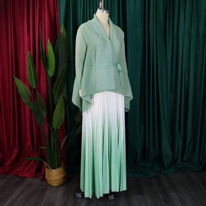 Sophisticated autumn/winter outfit for women by CM.YAYA, showcasing a flattering V-neck blouse and flowing pleated skirt.