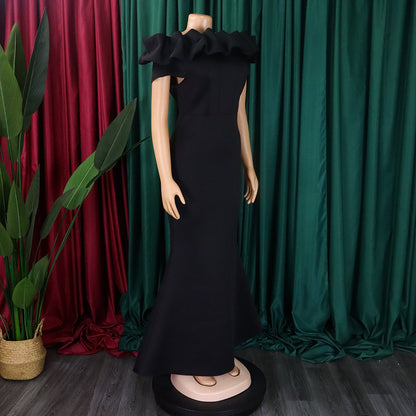 Back view of an elegant off-shoulder gown, illustrating the refined zipper closure and fitted empire waist for a graceful and sophisticated appearance.