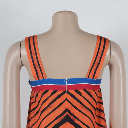 A woman confidently wearing the CM.YAYA Striped Wide Leg Sleeveless Jumpsuit, capturing the essence of summer fashion.