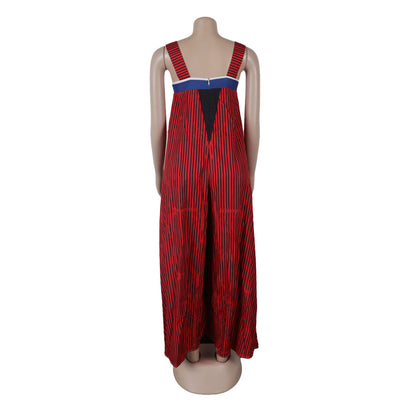 Model wearing the CM.YAYA Women’s Striped Wide Leg Sleeveless Jumpsuit, epitomizing luxury summer fashion, with stylish wide legs and chic high waist perfectly complemented by elegant accessories.