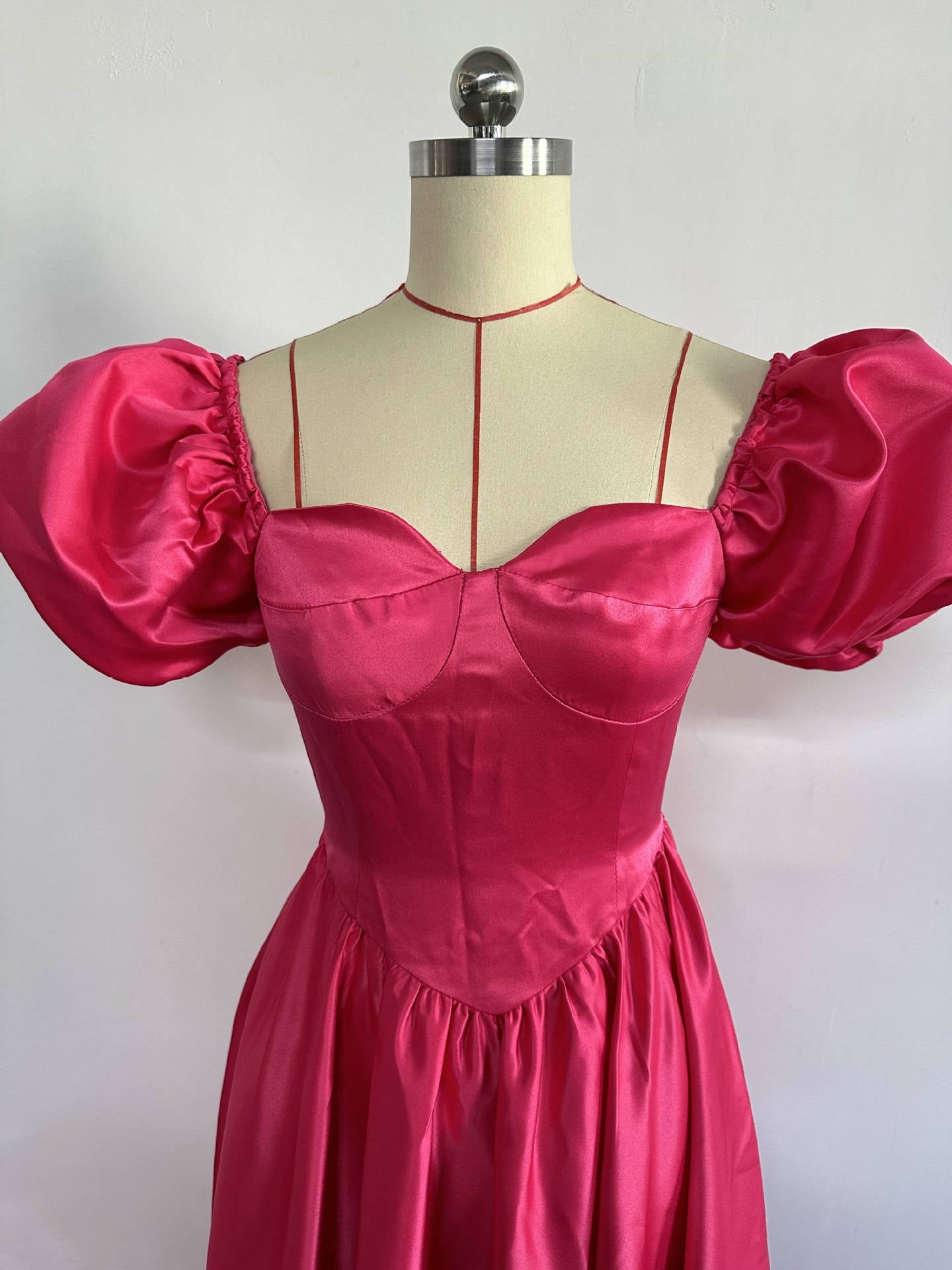 Elegant A-Line Midi Dress for Women with Sweetheart Neckline, Puff Sleeves, and Backless Design in Deep Pink, Perfect for Evening Parties and Special Occasions.