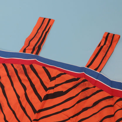 Sophisticated CM.YAYA jumpsuit featuring stylish wide leg pants and convenient pockets, perfect for a stylish summer outing.