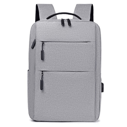 Sophisticated grey canvas business backpack, suitable for men and women, offering a blend of style and practicality for all occasions, from leisure to work.