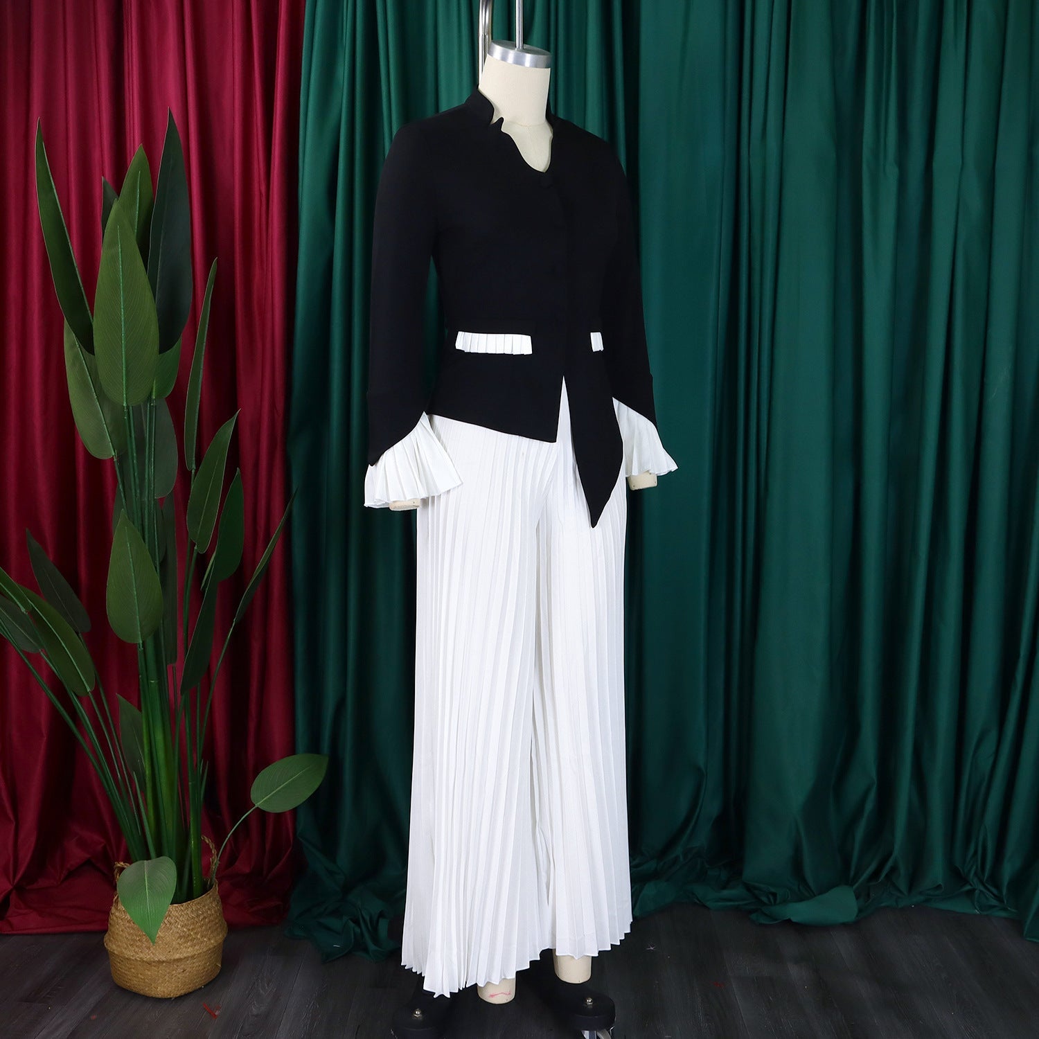 Model wearing the CM.YAYA Women's Plus Size Office Lady Flare Sleeve Blazer with matching wide leg pants, epitomising elegance and style.