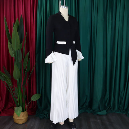 Model wearing the CM.YAYA Women's Plus Size Office Lady Flare Sleeve Blazer with matching wide leg pants, epitomising elegance and style.