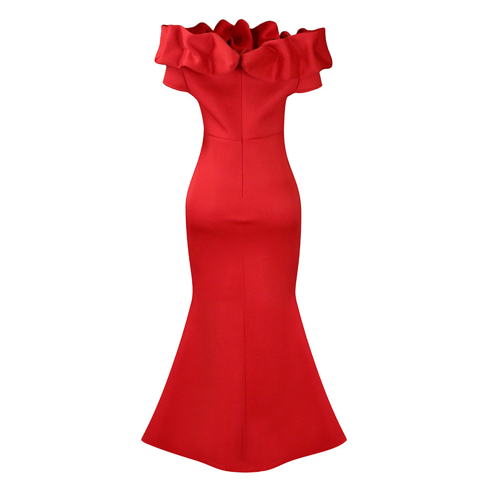 The gorgeous mermaid evening dress displayed on a mannequin, showcasing its vibrant colour and elegant style for eveningwear.