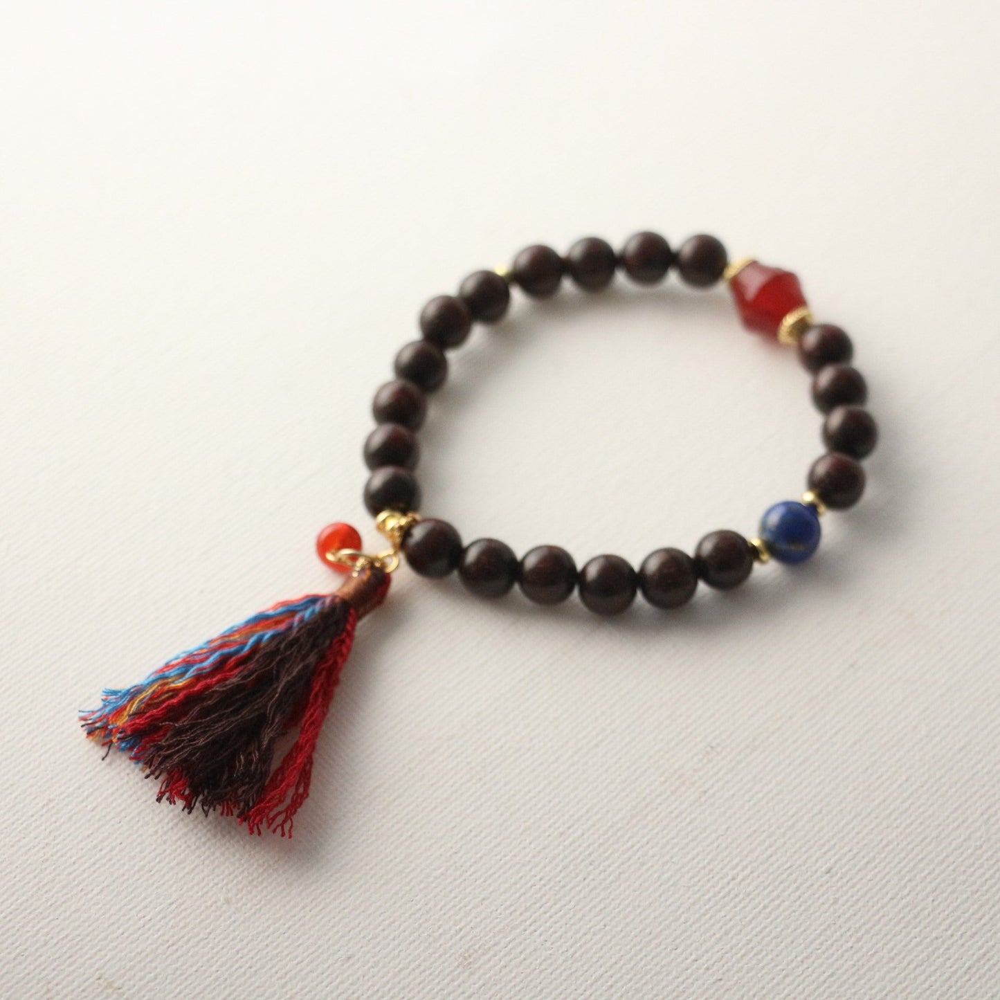 JEKIRA Black Gemstone & Ruby Tassel Bracelet