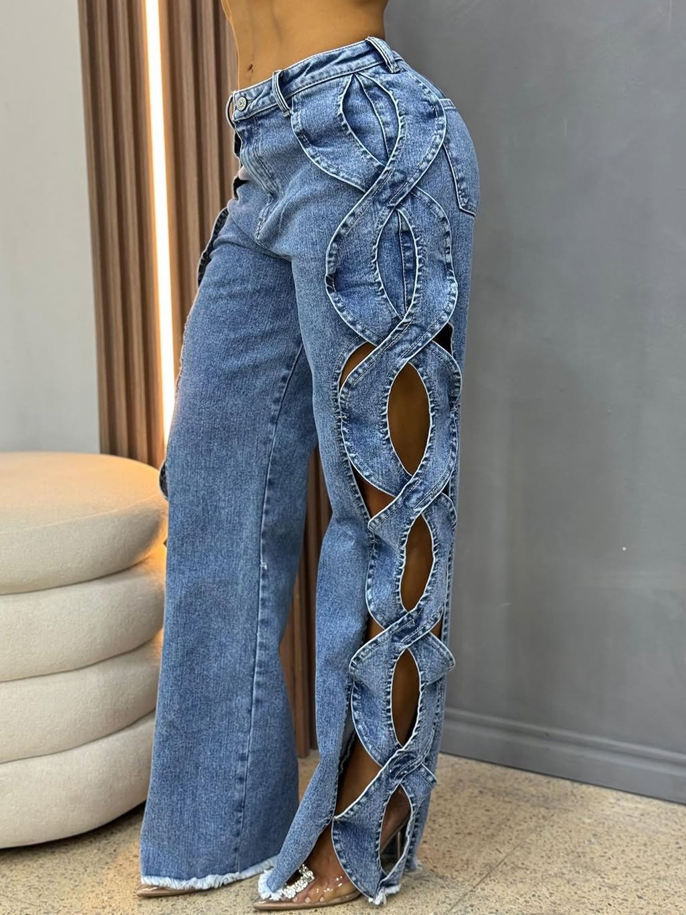 Luxurious full-length denim wide leg pants for women, crafted by BKQU with a stylish high waist and intricate hollow design, perfect for parties.