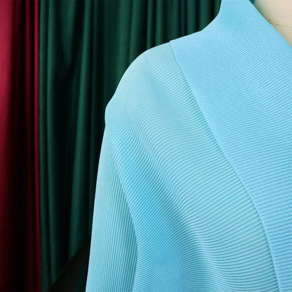 Fashion-forward CM.YAYA blouse and skirt set ensemble with batwing sleeves, designed for a luxurious wardrobe upgrade in the cooler months.