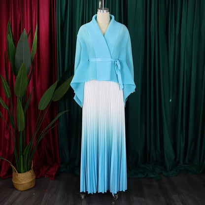 Stylish women's autumn/winter ensemble from CM.YAYA featuring a loose-fitting blouse and elastic waist skirt, blending comfort and luxury for the discerning woman.