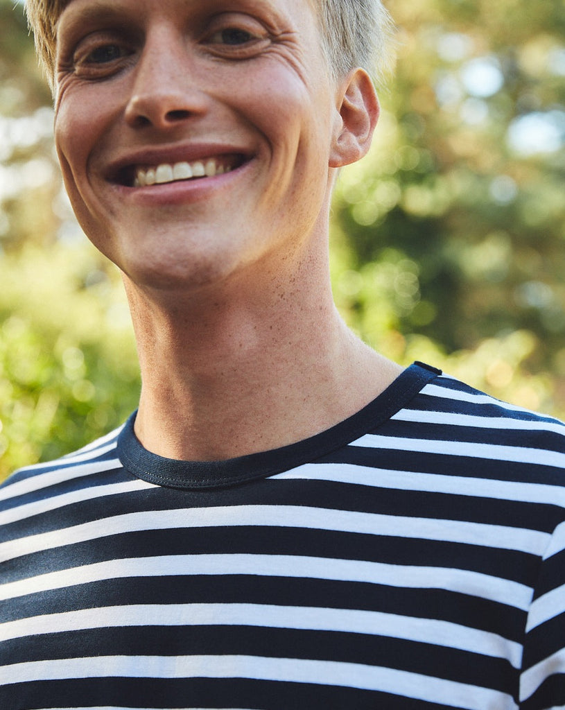 Model wearing the Fairtrade Organic Combed Cotton Long Sleeve T-Shirt, demonstrating the classic relaxed fit and elegant style.