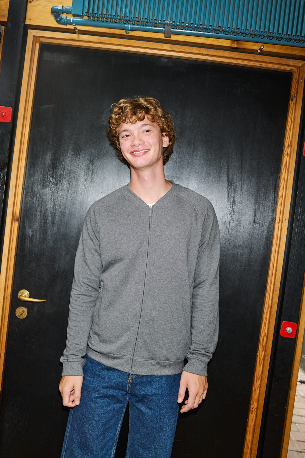 Elegant and sustainable unisex bomber jacket with a premium feel, designed for comfort with its double-layered rib collar and cuffs, emphasising eco-friendly fashion.