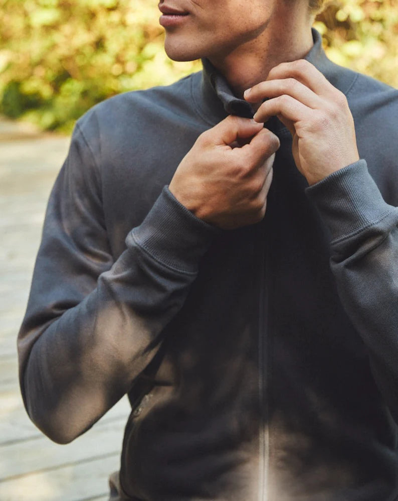 Close-up of the reversed YKK zipper on the Fairtrade Organic Cotton High Neck Jacket, highlighting attention to detail in sustainable design.