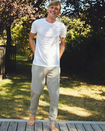 Luxurious Fairtrade Organic Unisex Sweatpants crafted from heavyweight fleece, featuring an adjustable fit, elegant design, and secure pockets, perfect for both men and women.