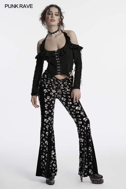 Close-up view of the soft velvet fabric and intricate skull print of Punk Rave flared trousers, showcasing lavish gothic fashion details.