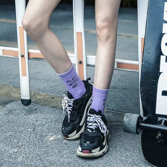 Close-up of Dazzling Dreams Women's/Girl's Street Sports Socks in a chic urban environment, featuring a playful message in a luxurious design, perfect for fashion-forward individuals.