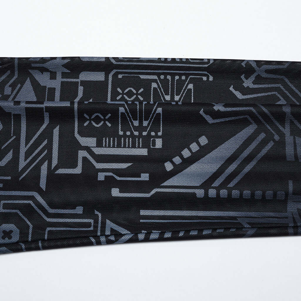 Flat lay of the Punk Rave Eluana Cybergoth Print Mesh Long Sleeve Top with detailed focus on its fabric composition and unique cybernetic skull motif.