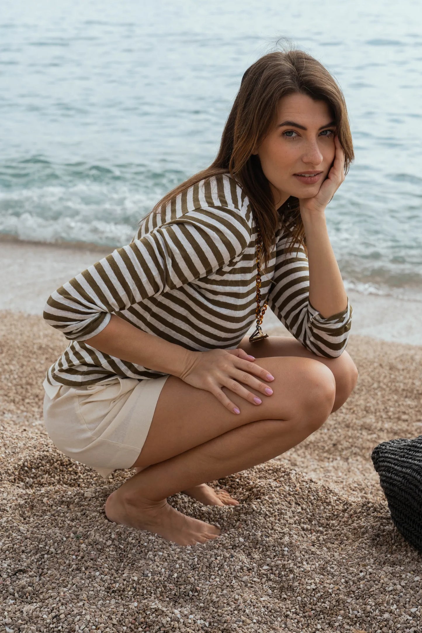 Styling options for women's classic striped linen t-shirt, paired with jeans and casual footwear for chic summer looks.