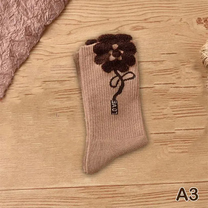 Chic brown middle tube socks adorned with a flower design, embodying the luxury and vibrant style of Women's Tie-Dye Middle Tube Socks.