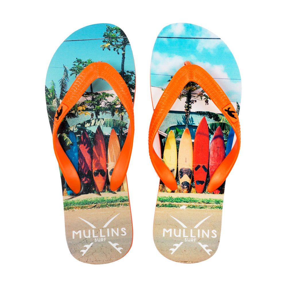 Luxury children's flip flops by Mullins Surf in vibrant bright orange, showcasing classic slim design and bouncy rubber material.