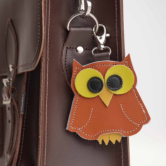 Luxury hand-crafted burnt orange owl bag charm made from genuine leather, showcasing exquisite craftsmanship by Zatchels, ideal for enhancing your accessory collection.