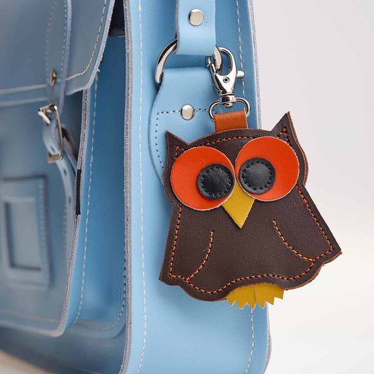 Luxury Hand-Crafted Dark Brown Owl Bag Charm made of embossed leather, showcasing exquisite craftsmanship and elegant design, perfect accessory to personalise and elevate your handbag collection.