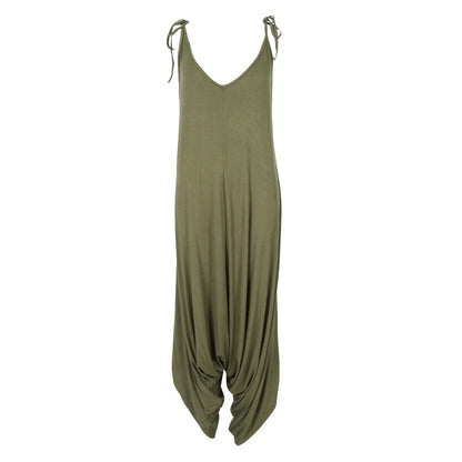Chic green harem jumpsuit featuring a relaxed silhouette and adjustable shoulder ties, suitable for UK dress sizes 8-16.