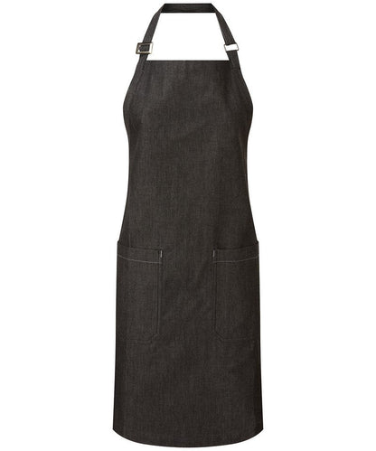 Elegant organic cotton denim apron highlighting two spacious mitred pockets and eco-friendly properties, perfect for gourmet cooking and sustainable fashion.