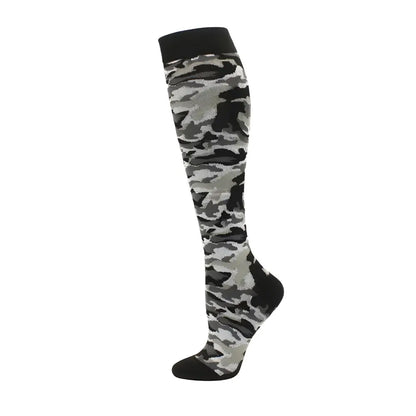 Trendy women's knee length compression travel socks featuring a camouflage pattern, an ideal blend of fashion and comfort for adventurous travels.
