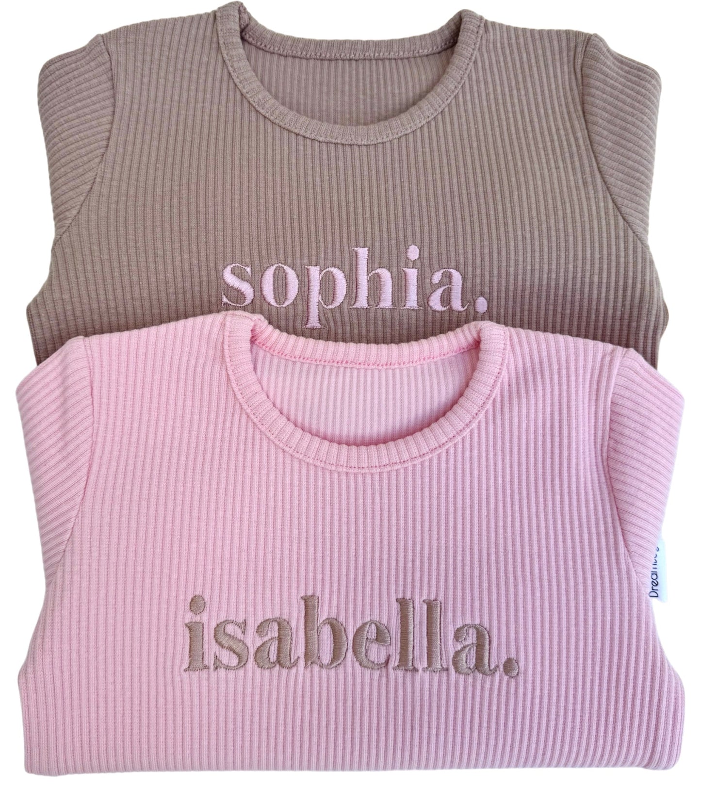 Elegant and minimalistic design of DreamBuy's matching pink pyjamas, featuring long-sleeve blouses and drawstring pants for ultimate comfort.