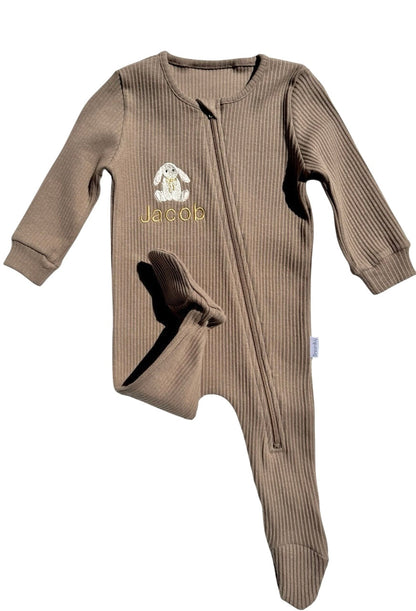 Soft cotton fabric of DreamBuy's baby zip romper with intricate safari animal designs, perfect for stylish infants.