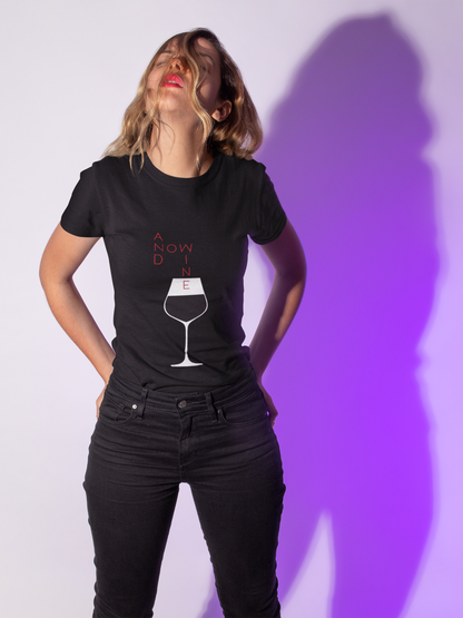 Black women's t-shirt displaying the jovial slogan 'And Now Wine', with an elegant wine glass design, a luxurious choice for wine lovers.